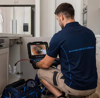 Clearing a blocked sink at a Merrylands property